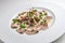 Dish of veal slices with mayonnaise of tuna and capers