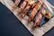 Dishes with lobsters, on a serving board on a black background. view from above. copyspace. seafood