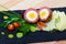 Dishes of traditional Scottish cuisine of scotch egg served with greens and potatoes