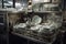 dishwasher in busy cafeteria, with plates and glasses being washed and dried