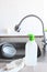 Dishwashing detergent, clean bowls, soap and a kitchen sink