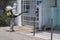 Disinfectant worker in protective suits with mask spraying disinfect chemical at community sources in public area to prevent the