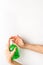 Disinfecting hands. Dispensing sanitizer on white background top view copy space