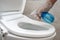 Disinfecting the toilet. Toilet bowl cleaning and disinfection. Prevention of coronavirus infection