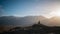 Diskit Monastery Buddha Statue, Nubra Valley, Leh Ladakh overlooking city mountain background