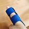 Dislocated little finger joint treatment with a blue protective splint