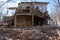 Dismantling of old building a building without wall and a roof with a rickety second floor a bunch of bricks and rubbish