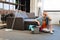 Dismissed mature woman being extremely tired and resting on floor