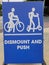 Dismount and push signage