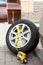 Dismounted car allow wheel rim with tire ready for inflate a tyre with pneumatic pump