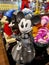 Disney cartoon character model doll, grey Minnie with guitar.