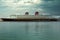 Disney Cruise Line Ship staying in dock of Port of Miami. Cruise Line Ship at dramatic sky.