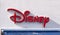 Disney logo sign on facade front of store. Close up image.