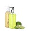 Dispensers with liquid soap and limes on white background