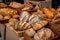 display of artisan breads, each loaf with unique shape and texture