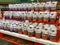 A display of bags of Almonds and Pecans at a Whole Foods Grocery Store