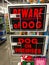 A display of Beware of Dog warning signs for sale at a Petsmart Superstore