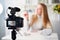 Display of camera recording video blog for blonde beauty blogger woman with make-up at home studio. Influencer vlogger