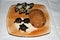 Display of Chocolate turtles and palm trees on a sugar beach with assorted cookies on a sand colored plate and white background