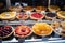 display of colorful fruit pies and tarts in bakery window