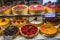 display of colorful fruit pies and tarts in bakery window