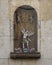 Display featuring the archangel Saint Michael vanquishing Satan on the wall of a church in Alfama.