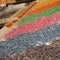 Display of a Food Store with Various Rows of Raw Coloured Pasta