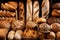 display of freshly baked bread with various shapes, colors, and textures