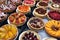 display of fruit pies and tarts, each with different toppings