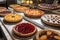 display of homemade fruit pies and tarts, each in a different style and flavor