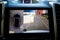 Display in interior of luxury car shows working of four cameras in surround view Parking assist system. 360 degrees Image display