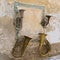 Display of old music instruments on the wall in Old Town of Radovljica, Slovenia