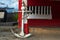 a display of a ship`s anchor standing on a wooden mast