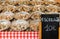 Display of snails escargots for sale with price sign in Parisian outdoor market