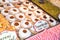 Display of traditional doughnuts on sale at Christmas market stall in Austria