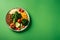 Display a vegetarian dish against a green-toned background with generous copy space