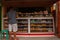 Display window of a bakery and pastry shop of with variety of baked goods, breads, donuts, puff pastry, closeup. Philippines.