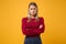 Displeased offended young blonde woman in casual clothes posing isolated on yellow orange background in studio. People