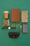 Disposable glass, wallet, organizer, wristwatch, pocketknife, mobile phone and sunglasses case on gr