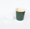 Disposable green coffee cup isolated