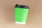 Disposable green paper cup with cap top view