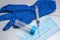 disposable medical mask,syringe, disposable blue glove, test tube for analysis