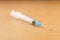 a disposable medical syringe lies on the street. The problem of drug addiction