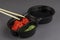 Disposable plastic container with sushi sauces and bamboo sticks