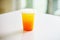 DISPOSABLE PLASTIC CUP DRINKS  on glass counter table in cafeteria