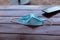 Disposable protective mask on a wooden table