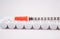 Disposable syringe on injection ampule pack