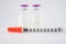 Disposable syringe on injection vials