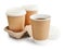 Disposable takeaway cups with coffee in holder