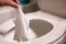 Disposable wipes being flushed down a toilet where they can cause clogging and problems with wastewater treatment.